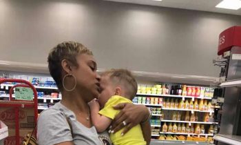 Mom Is Struggling After Both Kids Start Crying, Then A Stranger Walks Up And Picks Up Her Toddler