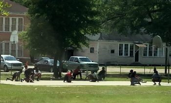 Teens Playing Basketball Stop And Kneel During Funeral Procession