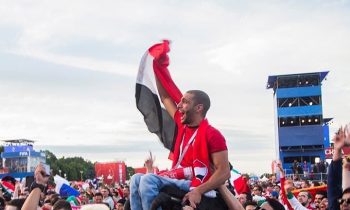 Egyptian Fan Is Lifted By Mexican And Colombian Fans So He Can See His Team Play